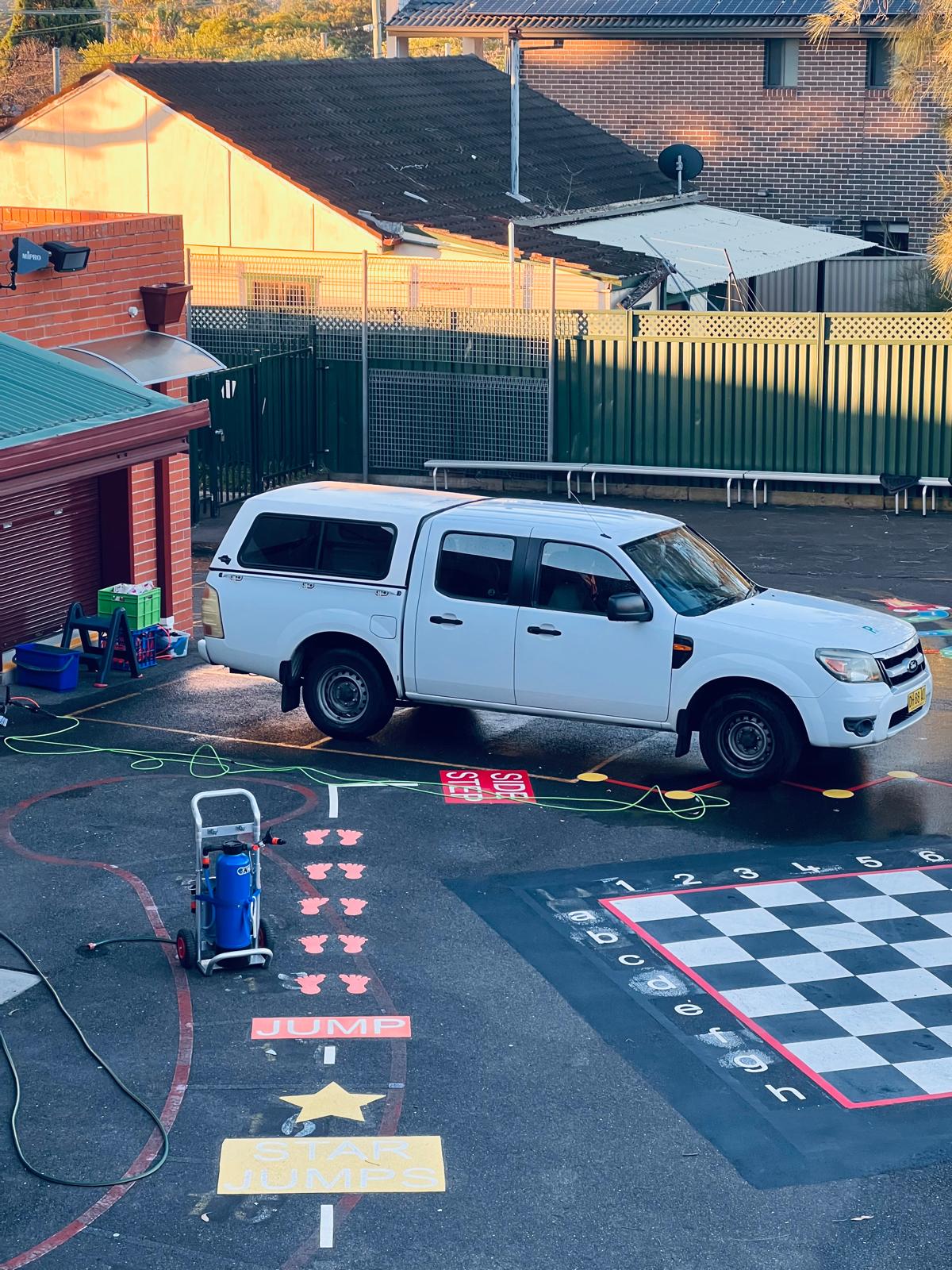 Water-fed pole cleaning setup on a school job